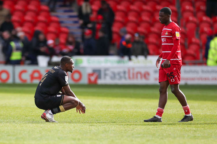 Rekeem Harper sinks to his knees at the final whistle at the Eco-Power Stadium (Picture credit: Kevin Warburton).