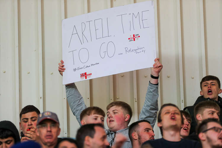 This Alex fan also had a cryptic message about a fellow supporter on his makeshift banner (Picture credit: Kevin Warburton).