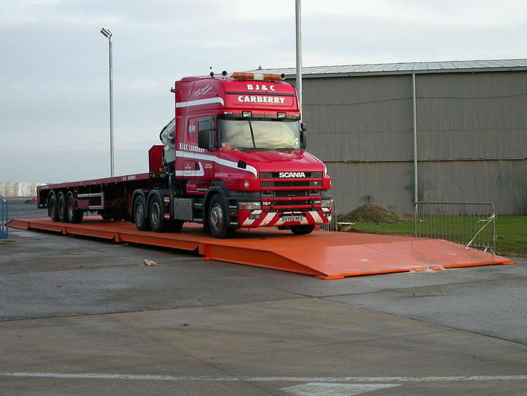 A weighbridge - also known as a truck scale - is a crucial part of HGV logistics. (Image - CC 1.0 2.0 3.0 Unchanged bit.ly/3BnzHv2)