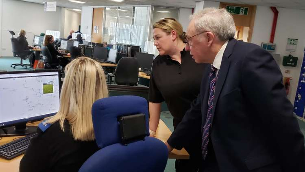 Chief Inspector Claire Jesson and Cheshire Police and Crime Commissioner John Dwyer watching a video livestreamed through the GoodSAM app to the force