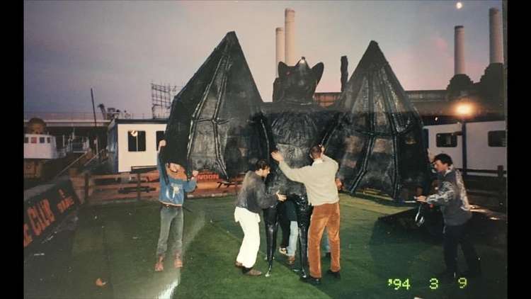 The fibreglass bat and Mark Garside (in the white trousers) in front of the iconic Battersea Power Station (credit: Mark Garside)