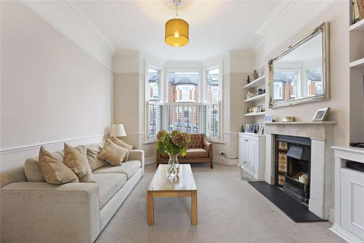 The reception room which boats bay windows and plantation shutters (credit: Chelwood Partners)