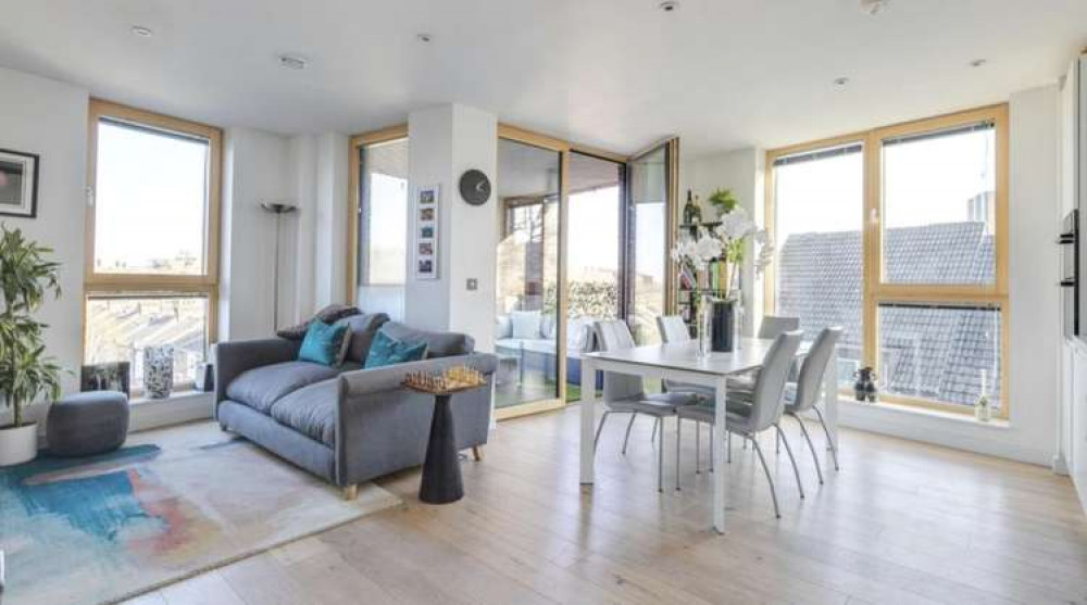 A stunning and light filled living room and kitchen (credit: Purple Bricks)