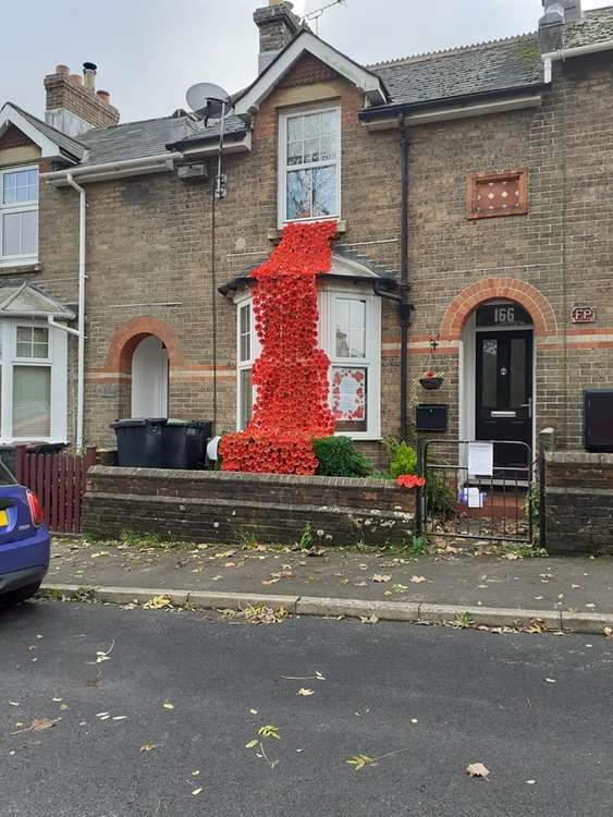 Fiona Hooper of Dorchester's Monmouth Road has so far raised more than £1,300 with her poppy display