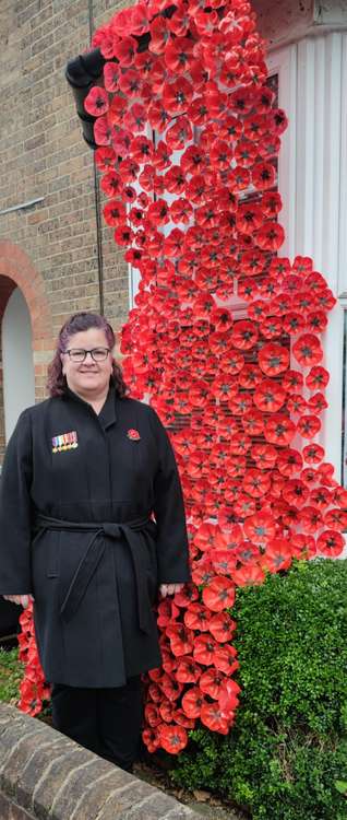 Fiona Hooper of Dorchester's Monmouth Road has so far raised more than £1,400 with her poppy display