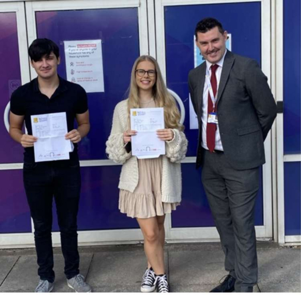 Principal Martin Brailsford with two very high achieving National Church of England Academy students. Photo courtesy of Hucknall National Academy.