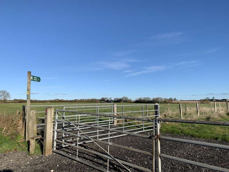 Go down the footpath signposted 'Higher Burton'