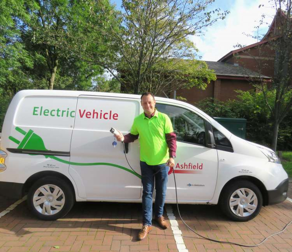 Cllr Jason Zadrozny with the Council's electric vehicle. Photo courtesy of Ashfield District Council.