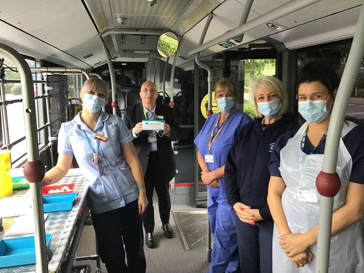 John Wilmott on the vaccination bus with staff. Photo courtesy of Ashfield District Council.