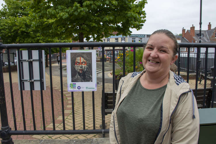 Councillor Deakin with some of the artwork. Photo courtesy of Ashfield District Council.