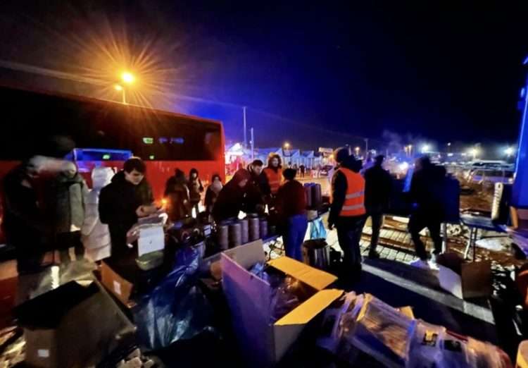 Volunteers from World Central Kitchen giving out food to Ukrainian refugees on the border with Poland