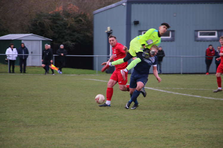 Hadleigh manager Steve Holder wiped out by Swaffham keeper (Picture credit: Ian Evans/Hadleigh Nub News)