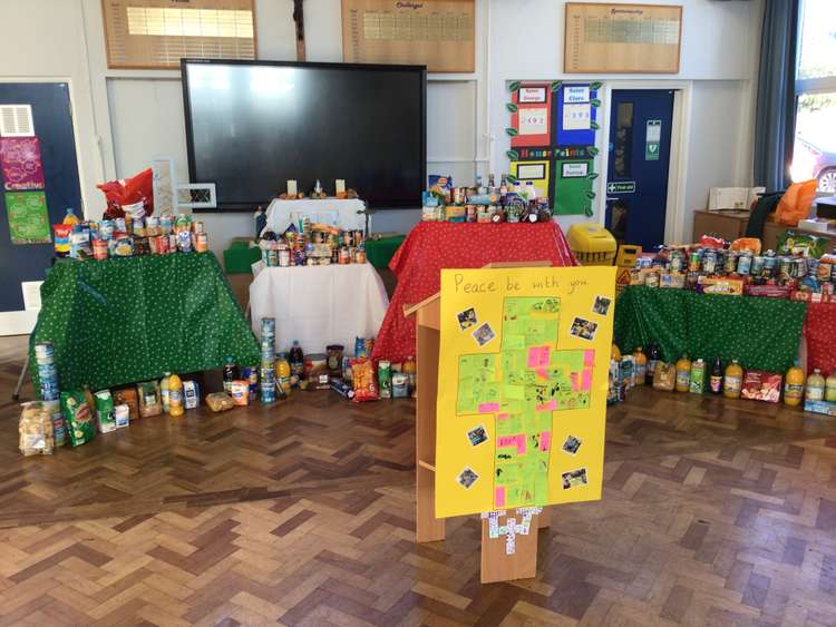 The food that had been collected was laid out for the school's Harvest Liturgy before being donated to Hucknall Food Bank. Photo courtesy of Holy Cross Primary Catholic Voluntary Academy.