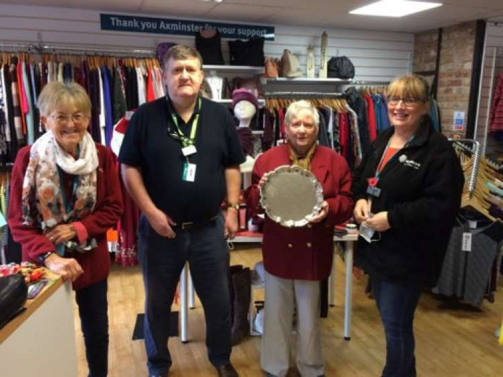 Jenny Hine, Steve White and Liz Crosfield accept the award from Yvonne Taylor on behalf of the Hospiscare shop team