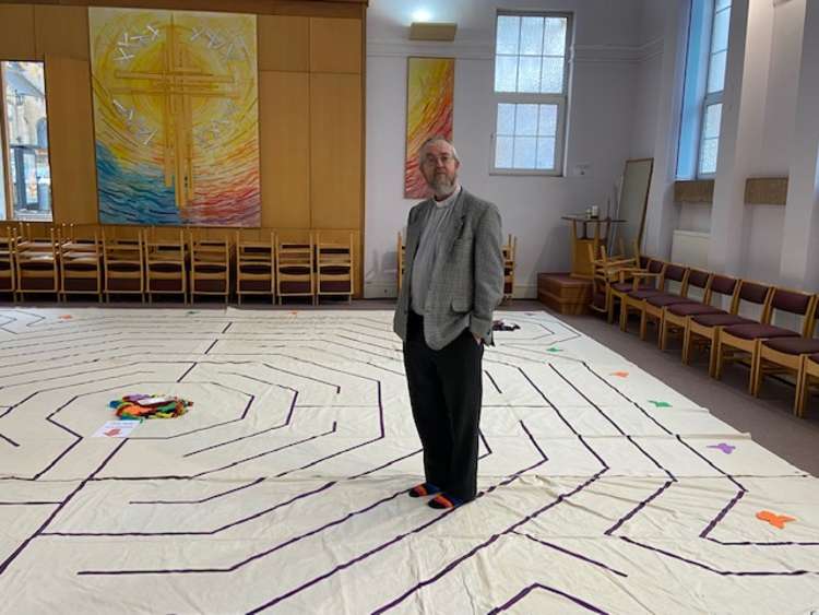 Rev John Wiseman (pictured) standing on the labyrinth at Central Methodist Church. Photo Credit: Tom Surgay