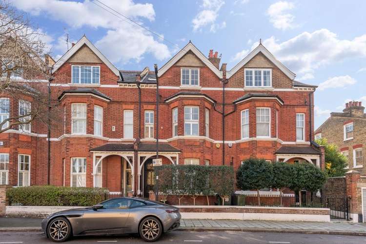 Located on a quiet tree lined street in Abbeville Village, the house is handsomely set within a terrace of five uniquely built homes (Image: John D Wood)