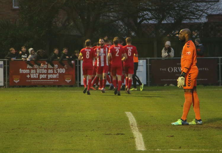 Joshua Hitter being congratulated after scoring Seasiders' winner against Hashtag United (Picture credit: Ian Evans)