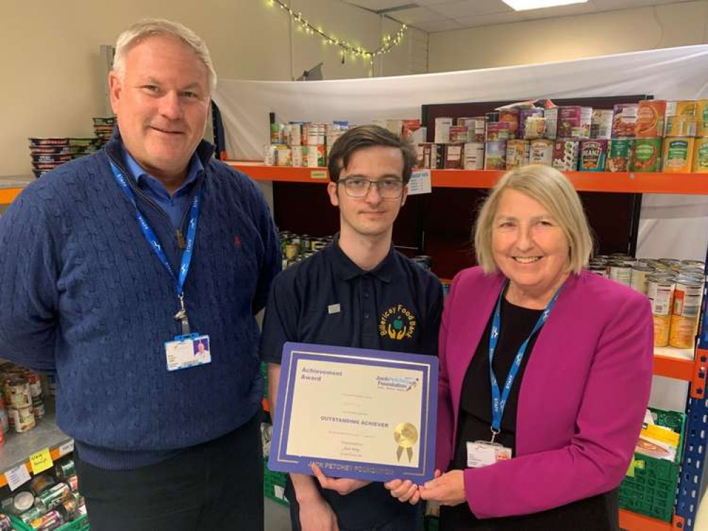 Angela O'Donoghue, principal and chief executive of the college, and Trustee and college job coach, Stuart Gibbs, presented the award to Elliot.