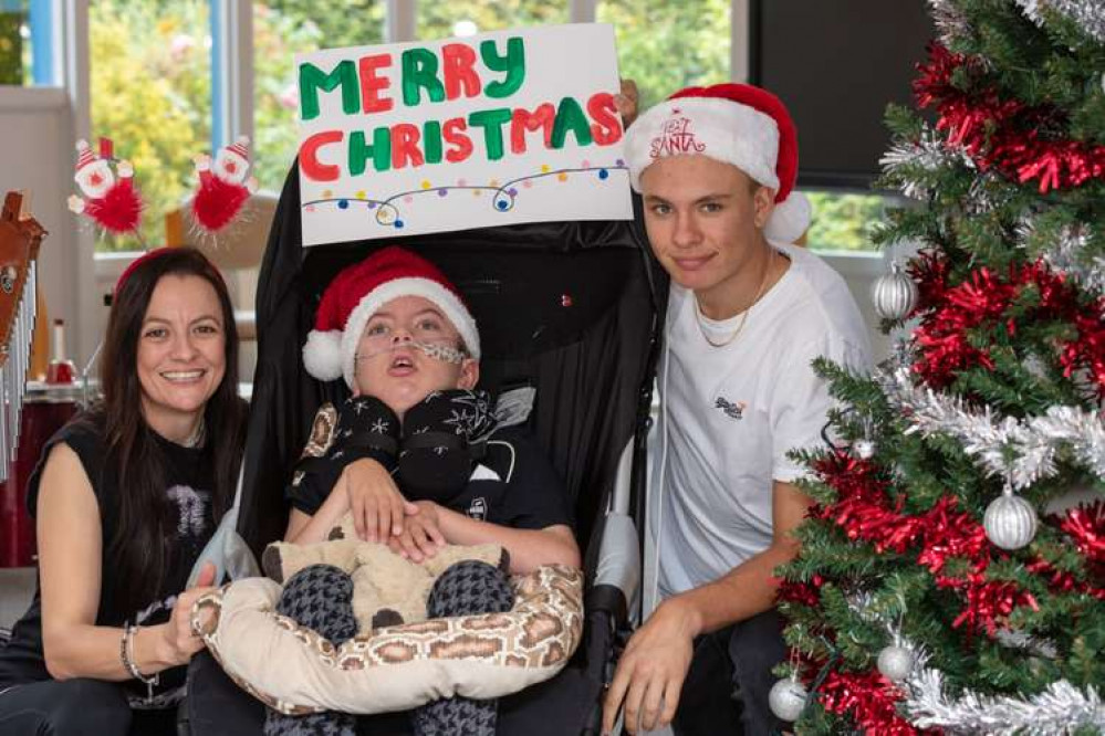 How you can help make a difference for this family and others: Mum Sarah, hospice user Phoenix, and big brother Rico – The family have been coming to Little Havens since 2015.