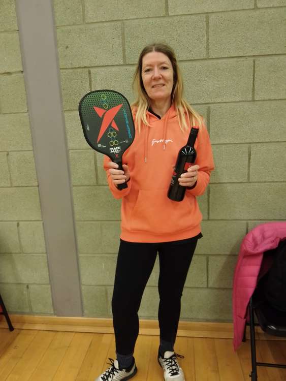 WINNER - Karen Morris with her prize of a Drop Shot Radikal paddle and a bottle of wine!