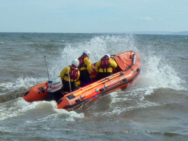 Exmouth RNLI inshore lifeboat in action Credit : RNLI