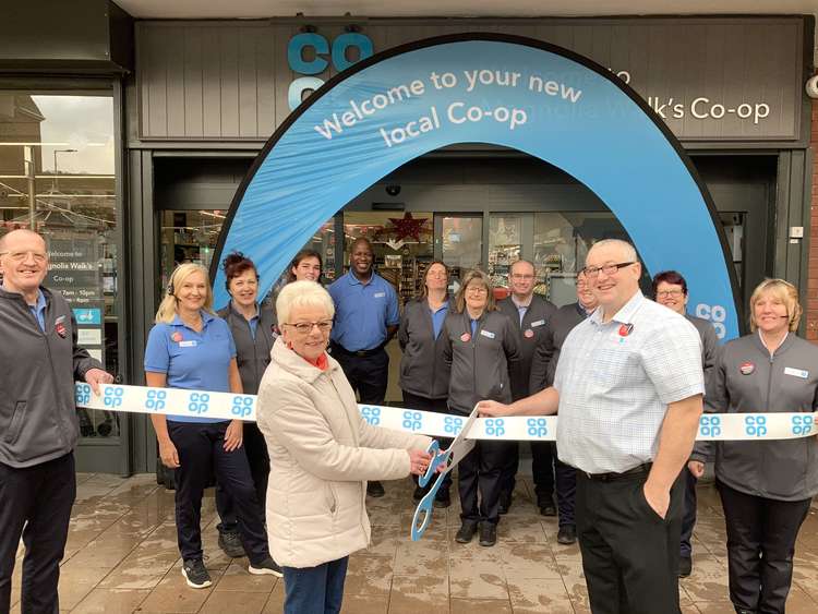 Co-op Manager Joseph Cacchione (right), with a long-time customer opening the newly refurbished store