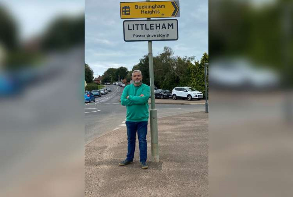 Cllr Bruce de Saram underneath Littleham sign