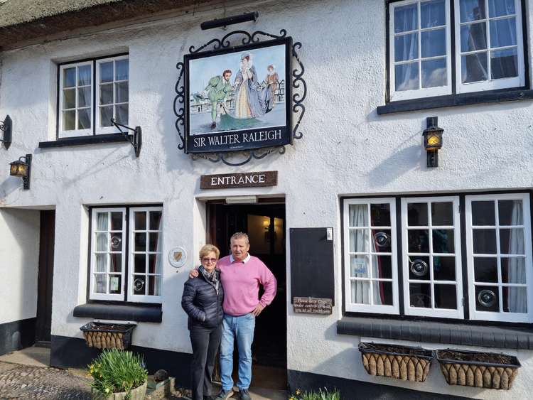 New landlords Carole and Darren Yates in the doorway of the Sir Walter Raleigh pub (Sir Walter Raleigh community pub)