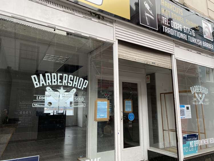 The Church Street barbershop with the notice on the window.