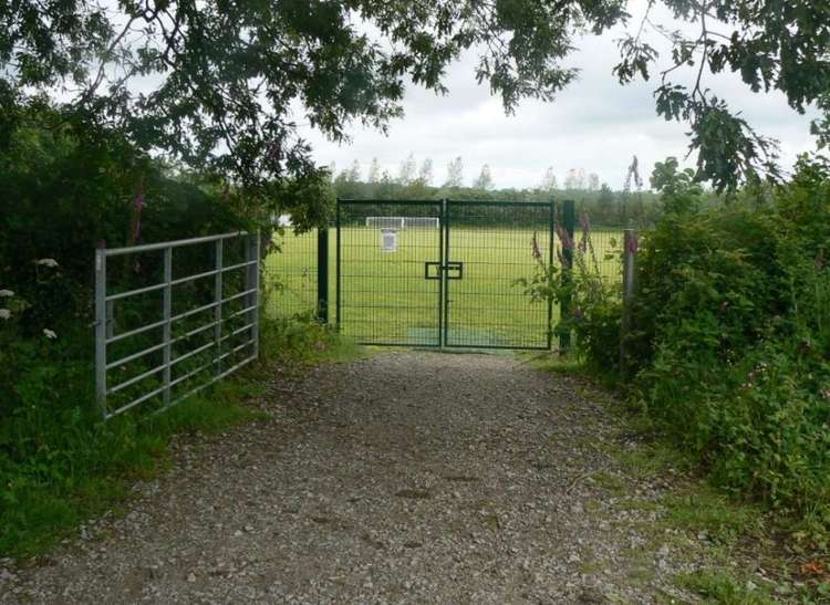 Entrance to the playing field leading to the woodland.