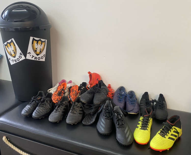 The bin donated by The F Troop alongside the boots that have already been donated.