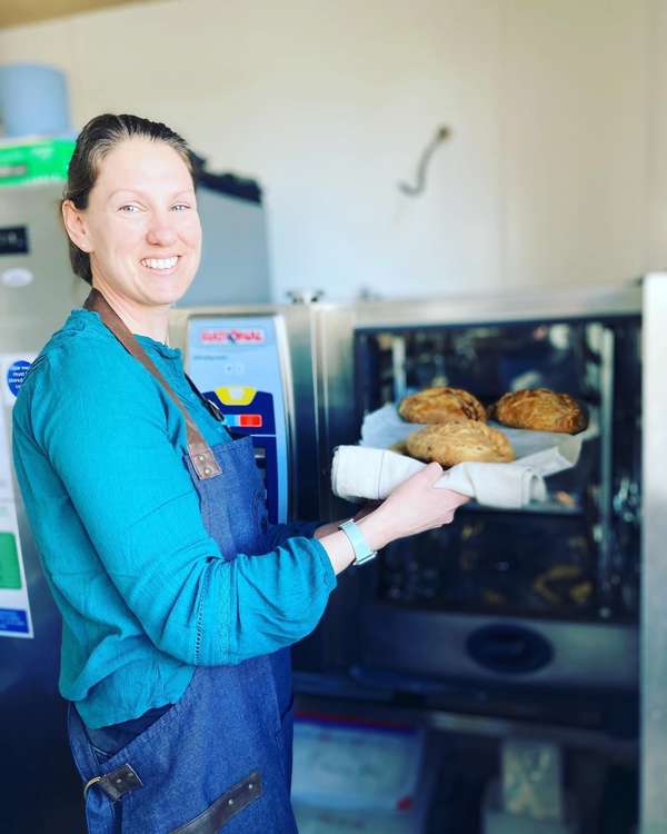 Owner Amelia taking some Ann's Pasties out the oven.