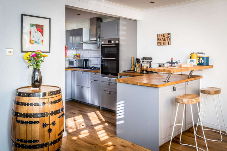 The modern kitchen with breakfast bar and Bosh applicances  (Image: Carringtons)