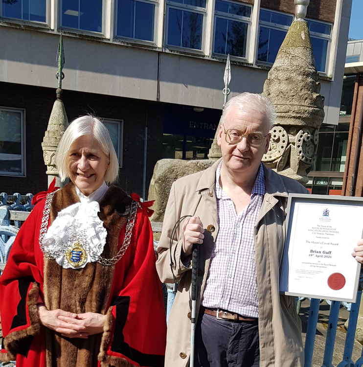 Brian Gaff (right) receives his award from the Mayor