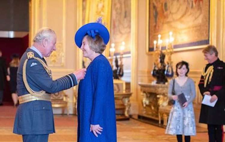 Former Chief Superintendent Sally Benatar receives the Queen's Police Medal from the Prince of Wales