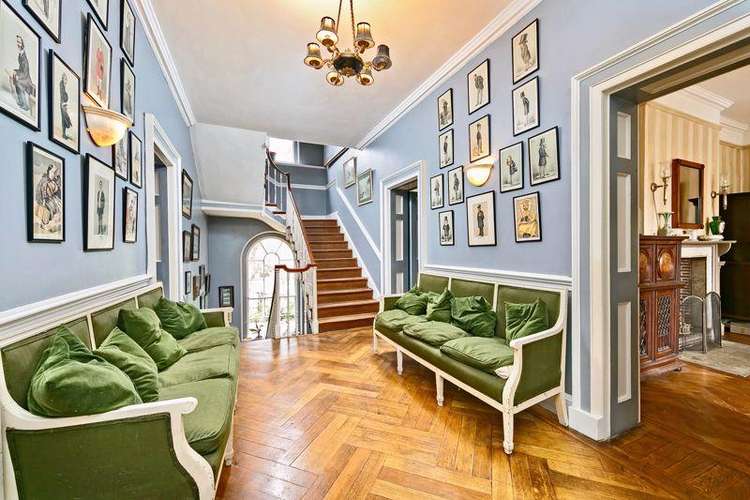 The elegant staircase and hall seating area