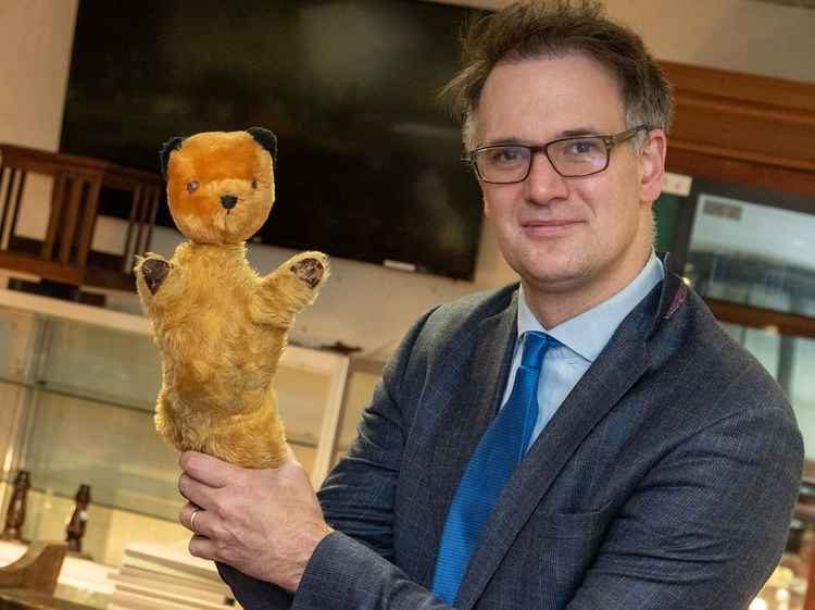 Charles Hanson, owner of Hansons, with the  Harry Corbett Sooty given to Robin Vyrnwy-Pierce