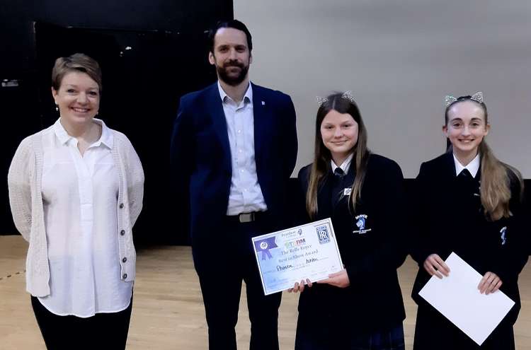 Year 8 students Phoebe and Bridget who won The Best in Show Award with their science investigation 'Claw-some Catnip' - with representatives from Rolls Royce