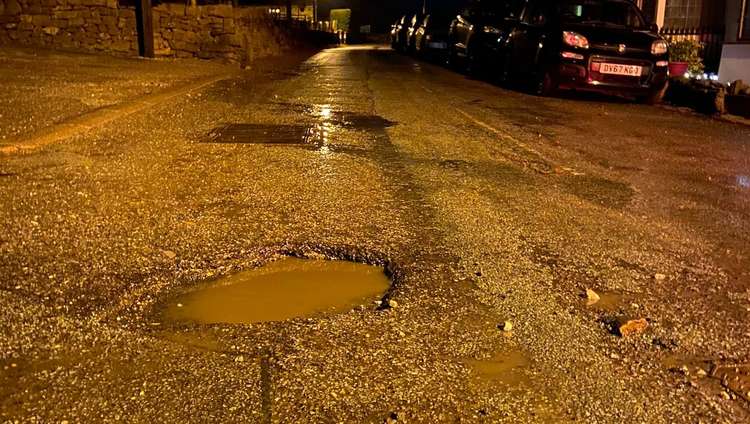 Several residents say their vehicles were damaged by the pothole. Image credits: Joan Jackson