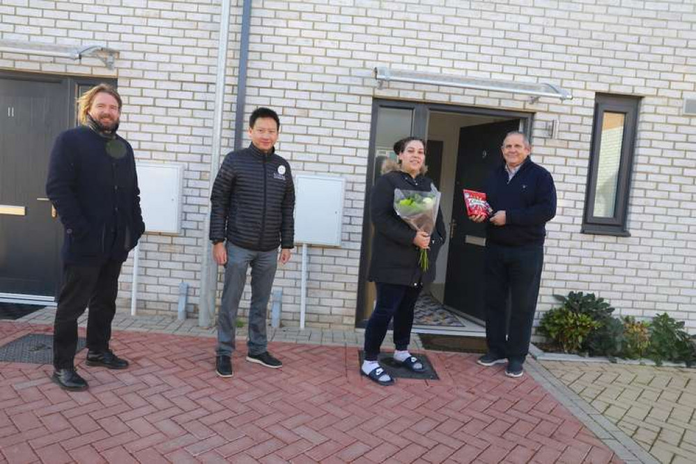 Matt Townend, Chief Operating Officer at Ecoworld, Heng Leong Cheong, CEO of EcoWorld London, and Cllr Steve Curran welcome Layla el-Hussein to her new home in Herings Hall Close. (Image: Hounslow Council)