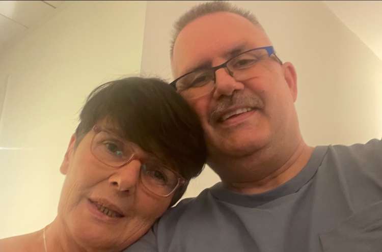 Stuart Haskins' family has launched a £34,000 crowdfunder to bring him home after he caught Covid in Cyprus, pictured in Stuart and his wife Tracey