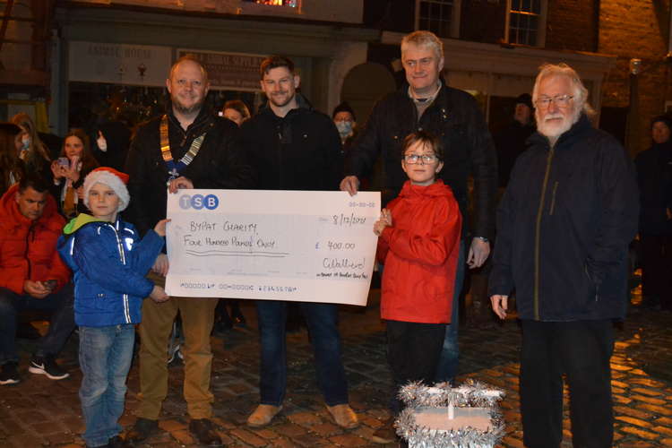 Bridport Round Table present children on Bridport Primary School's school council and Arthur Woodgate of BYPAT with a cheque for £400