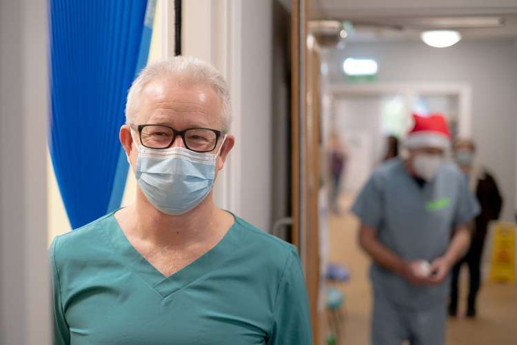 Photographer Eddy Pearce captures the first Covid booster vaccines at Bridport medical centre (Image: Eddy Pearce)