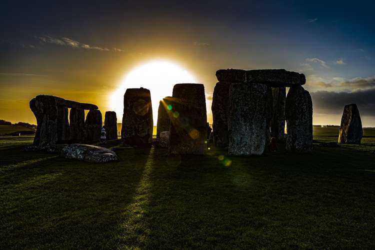 Many people celebrate the sunrise at Stonehenge