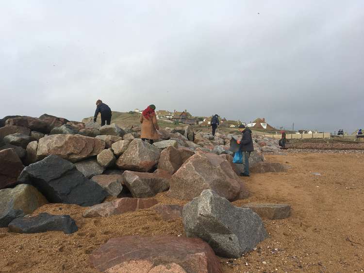 More than people 100 took to West Bay for a beach clean in memory of Simon Jordan (Image: courtesy of Roy Beal)