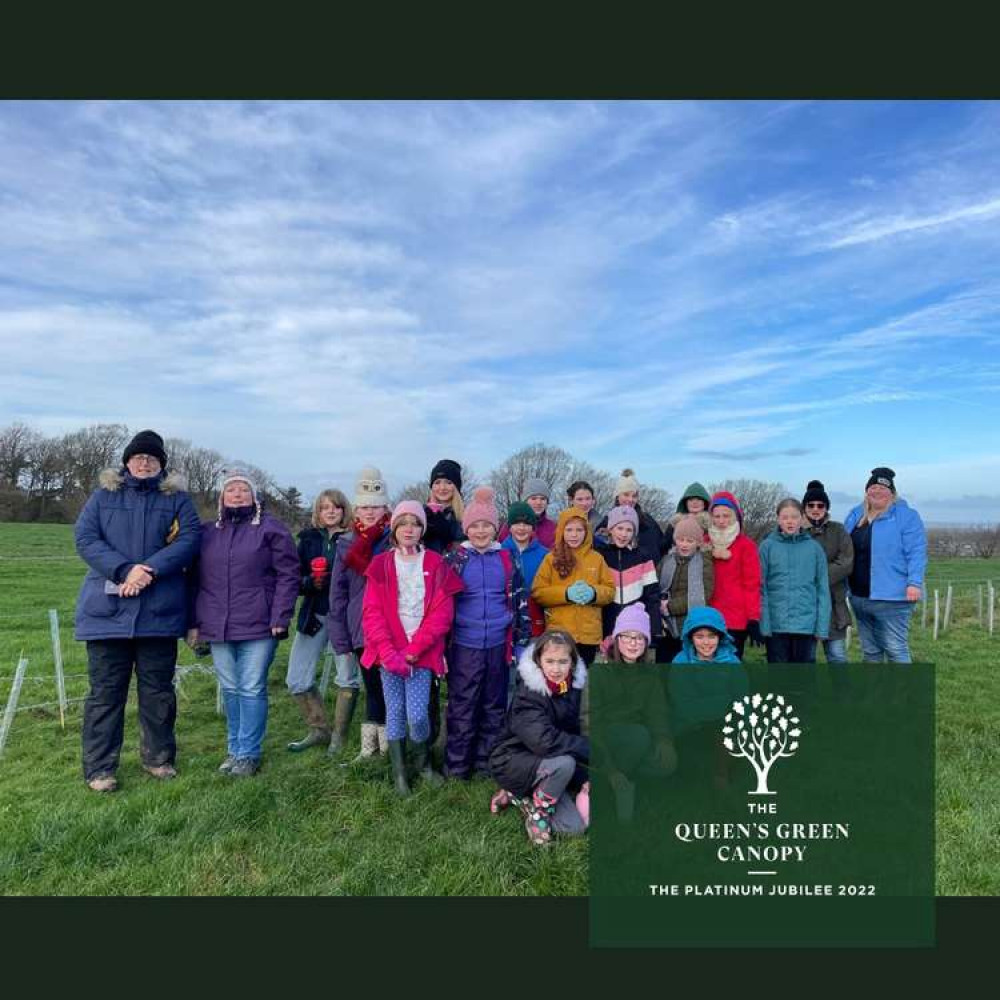 West Dorset Guides and Rangers plant more than 600 trees for the Queen's Green Canopy and reinstate the Dorset/Somerset county boundary