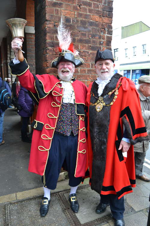 Town crier John Collingwood and Bridport mayor Ian Bark await Tom Daley's arrival