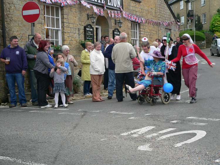 A pram race outside the pub in 2012