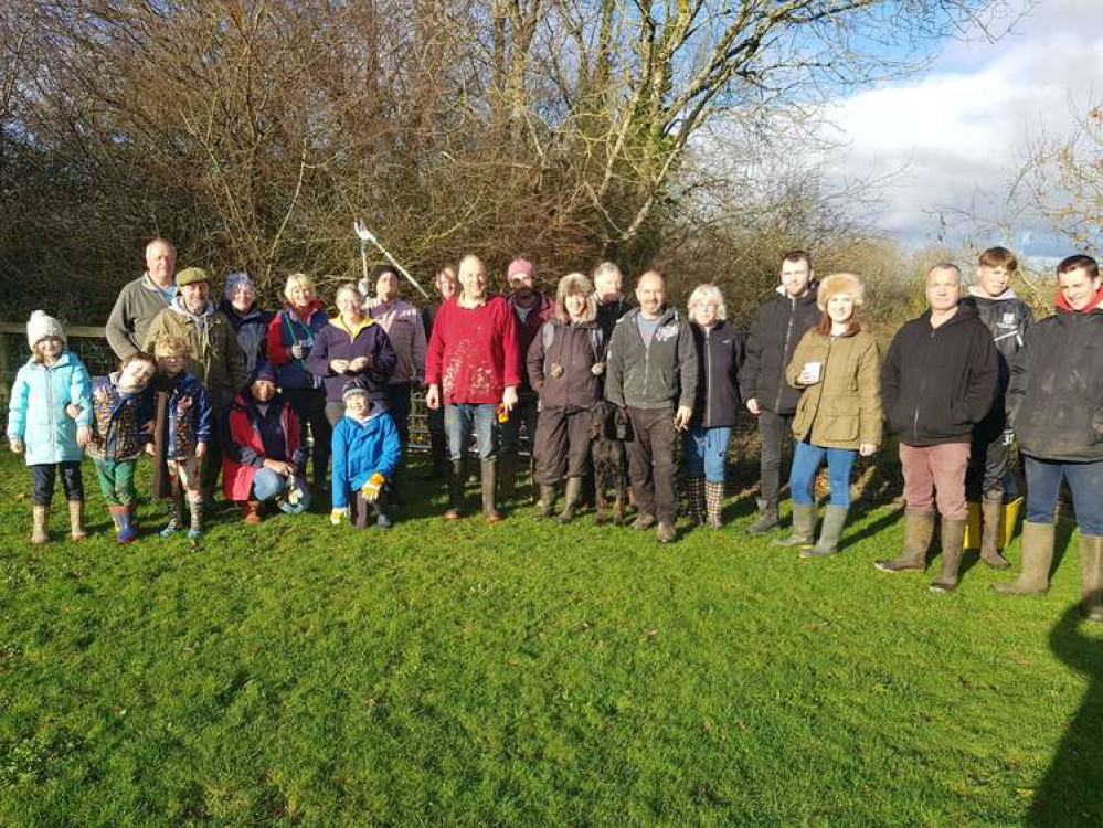 Broadwindsor parish councillor David Leader, pictured centre in red, has died aged 65