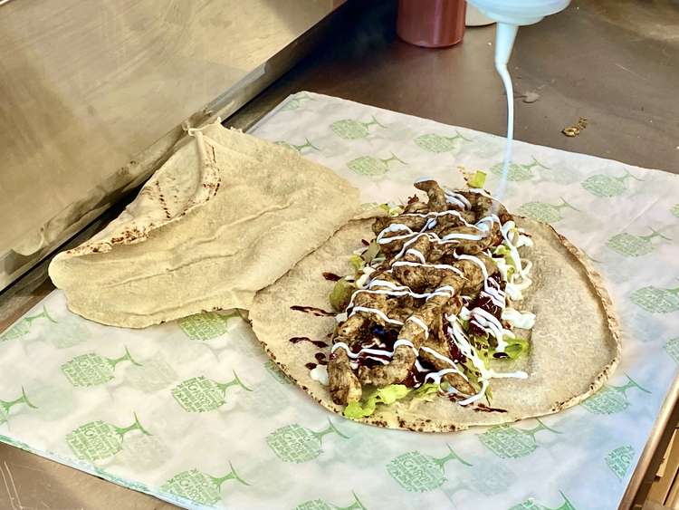 We tried the exceptionally tasty Shawarma wrap which you can see being prepared here